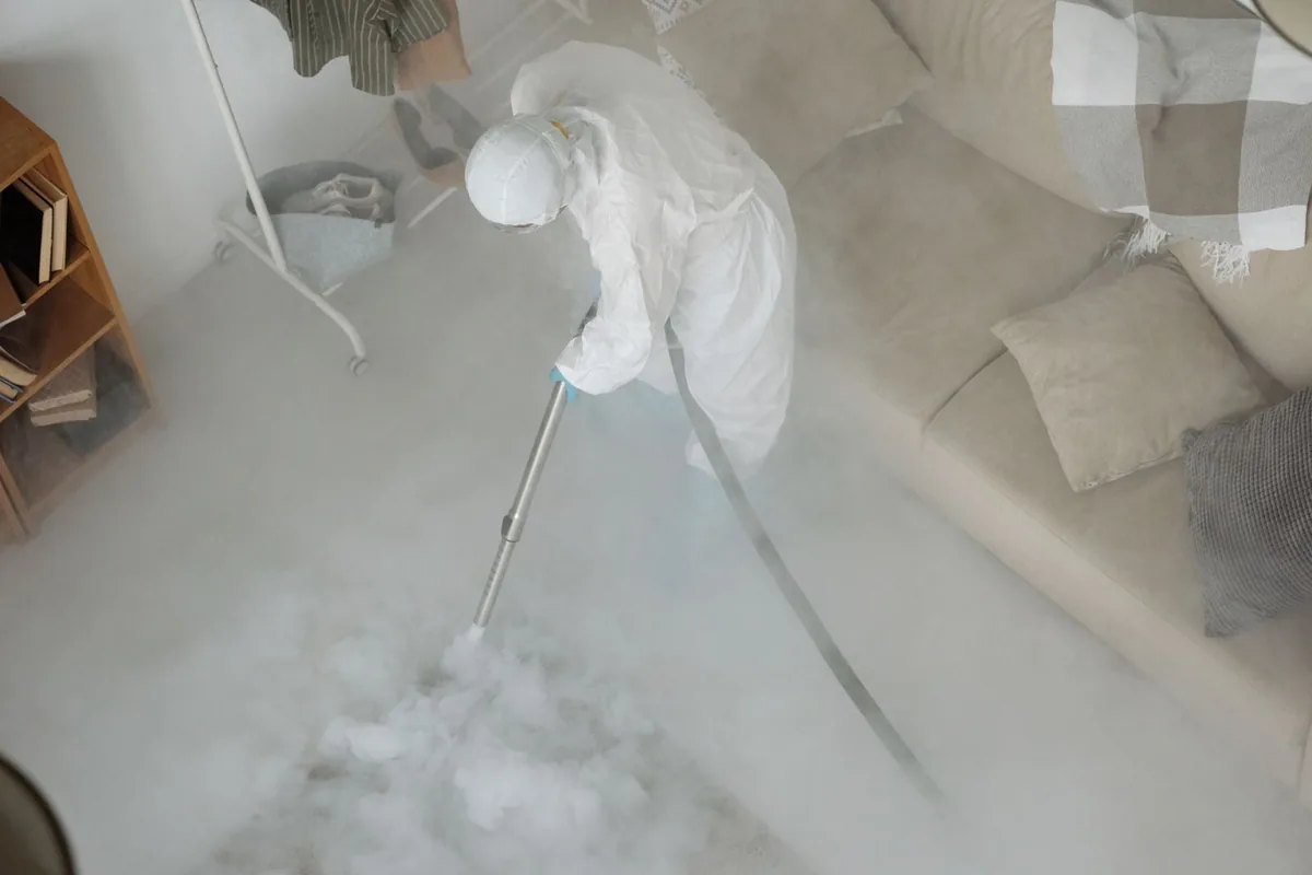 Biohazard cleanup technician in protective equipment, Interlachen, FL
